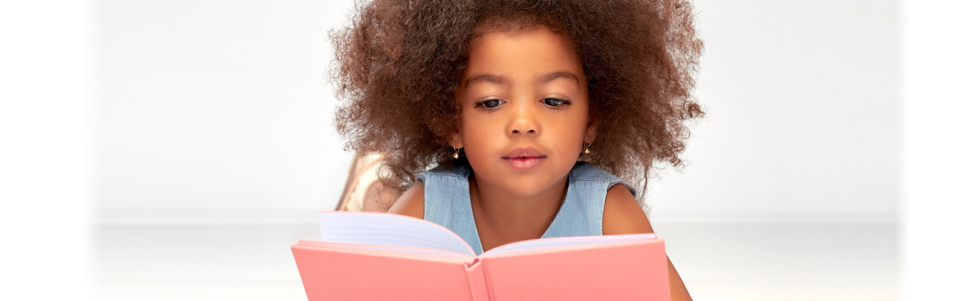 A young girl reading book